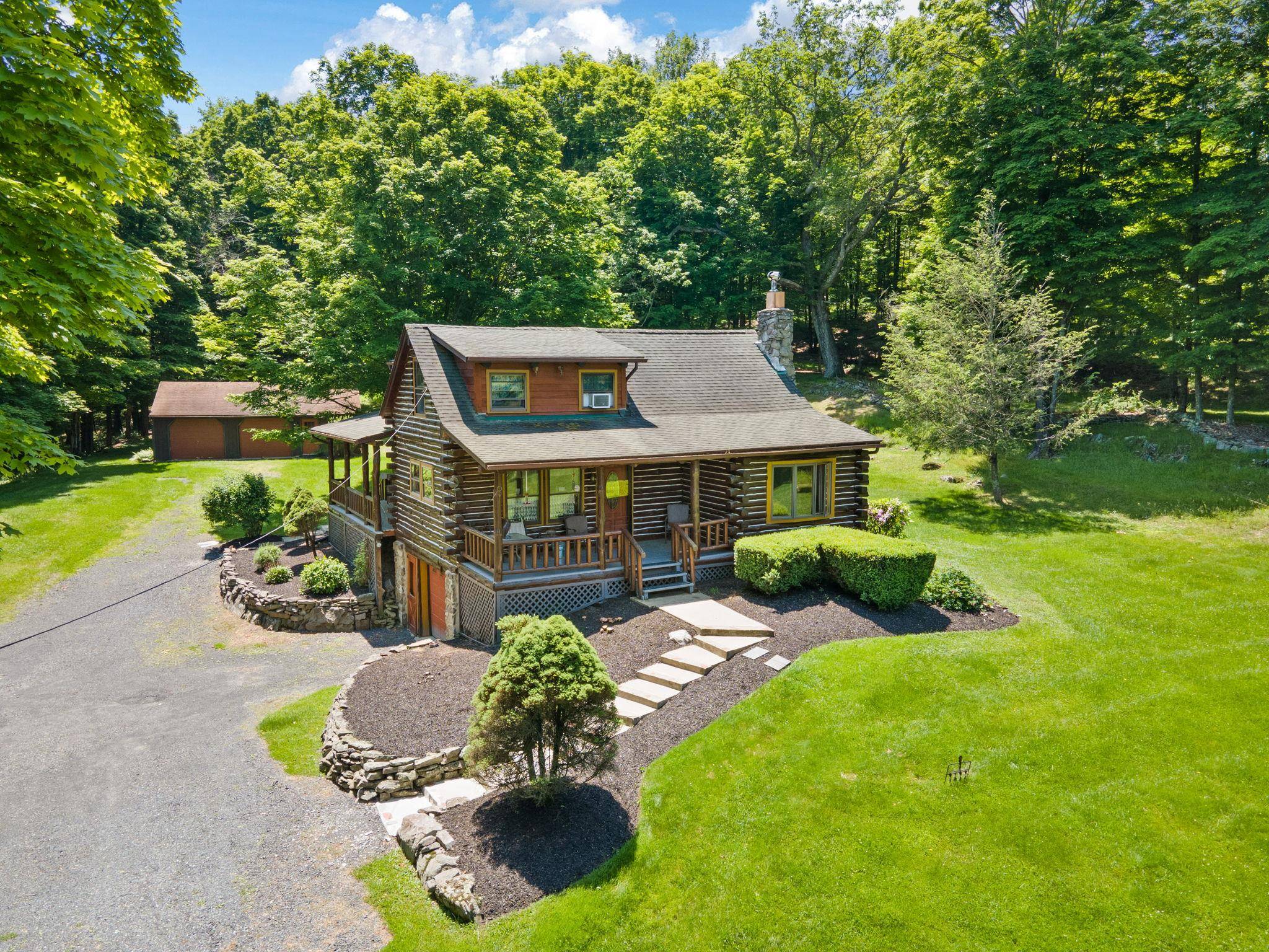 TOWN OF CRAWFORD LOG HOME SITUATED ON 25 ACRES OF SERENE WOODED LAND.