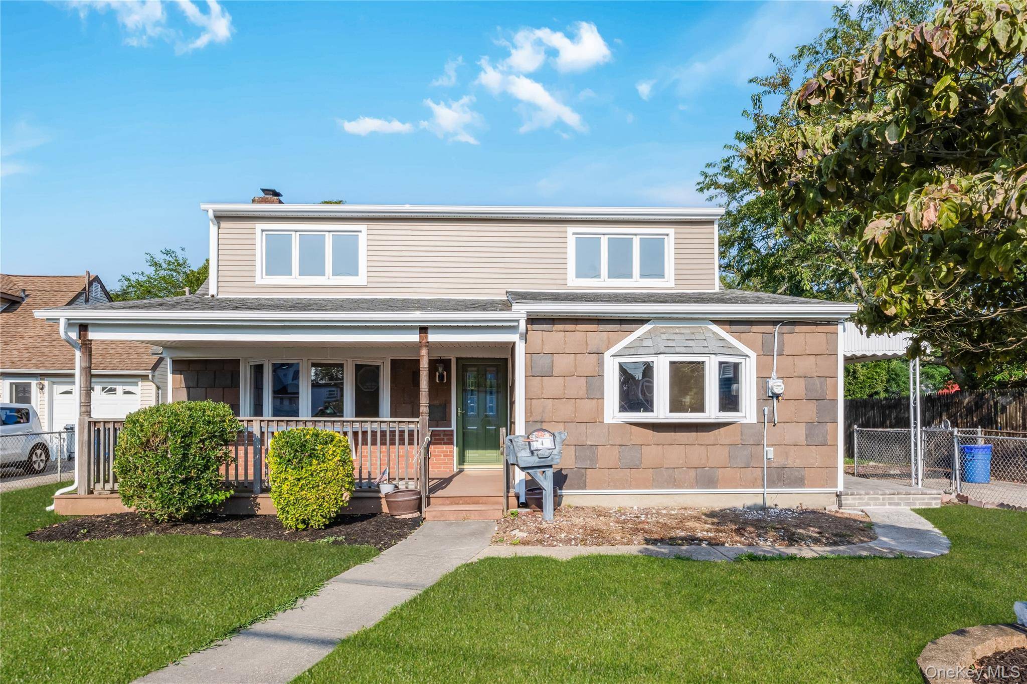 Gorgeous fully renovated large expanded cape situated on a quiet mid block but close to everything.