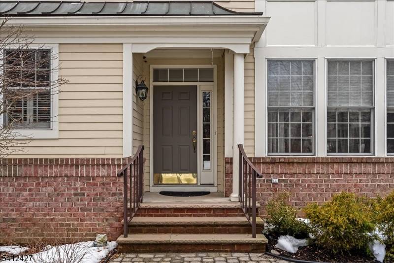 Exceptional end unit townhouse in the highly sought after Sterling Green community.