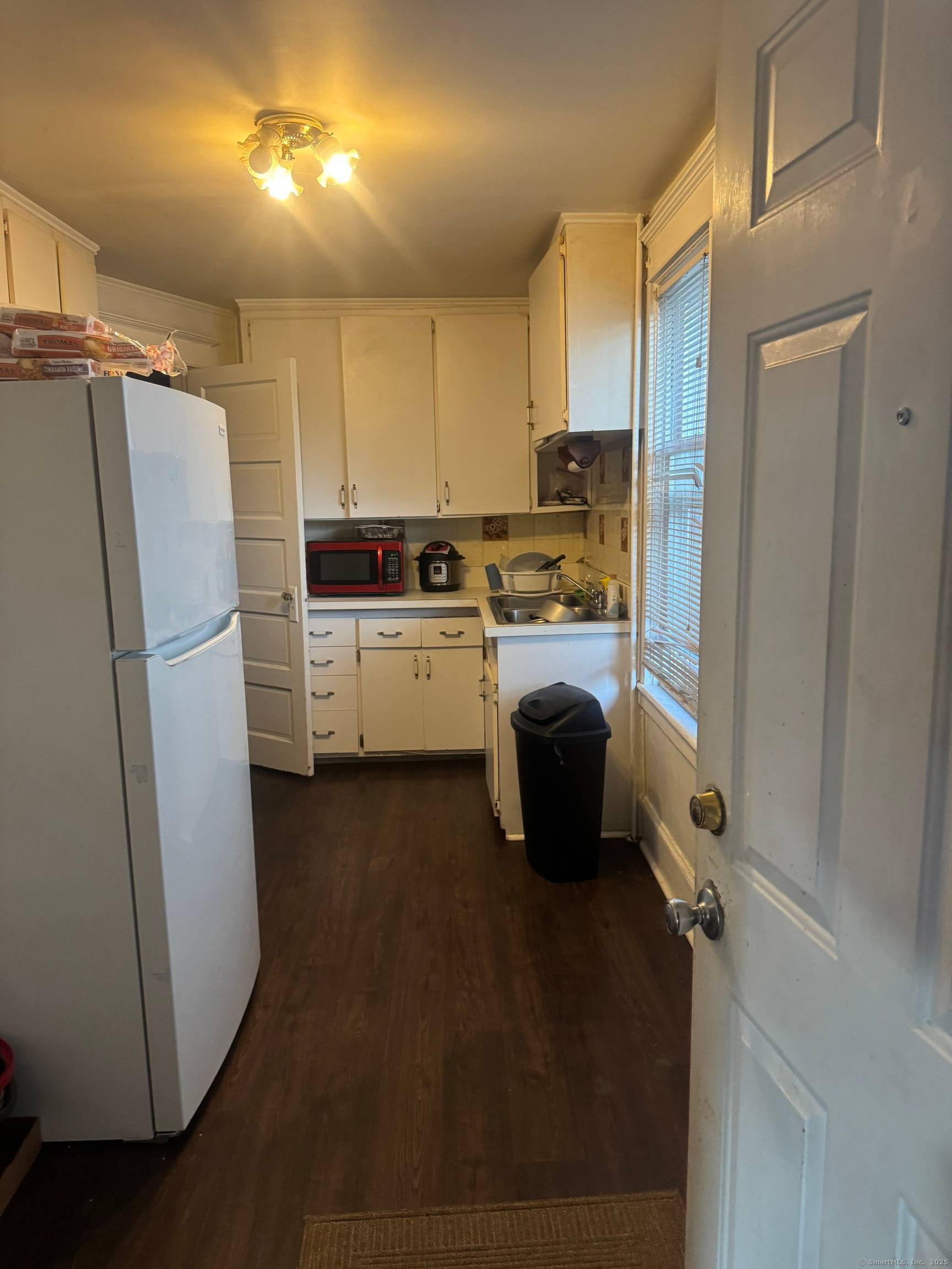 Welcome to this rare and expansive 2 family residence offering a total of 9 generously sized bedrooms and multiple living spaces, perfectly designed for multigenerational living or rental income opportunities.