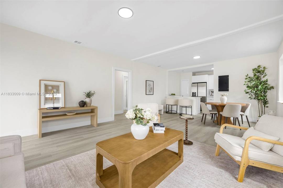 Stunning fully remodeled 3 bedroom, 2 bathroom home featuring a brand new roof, impact windows, and custom upgrades throughout.