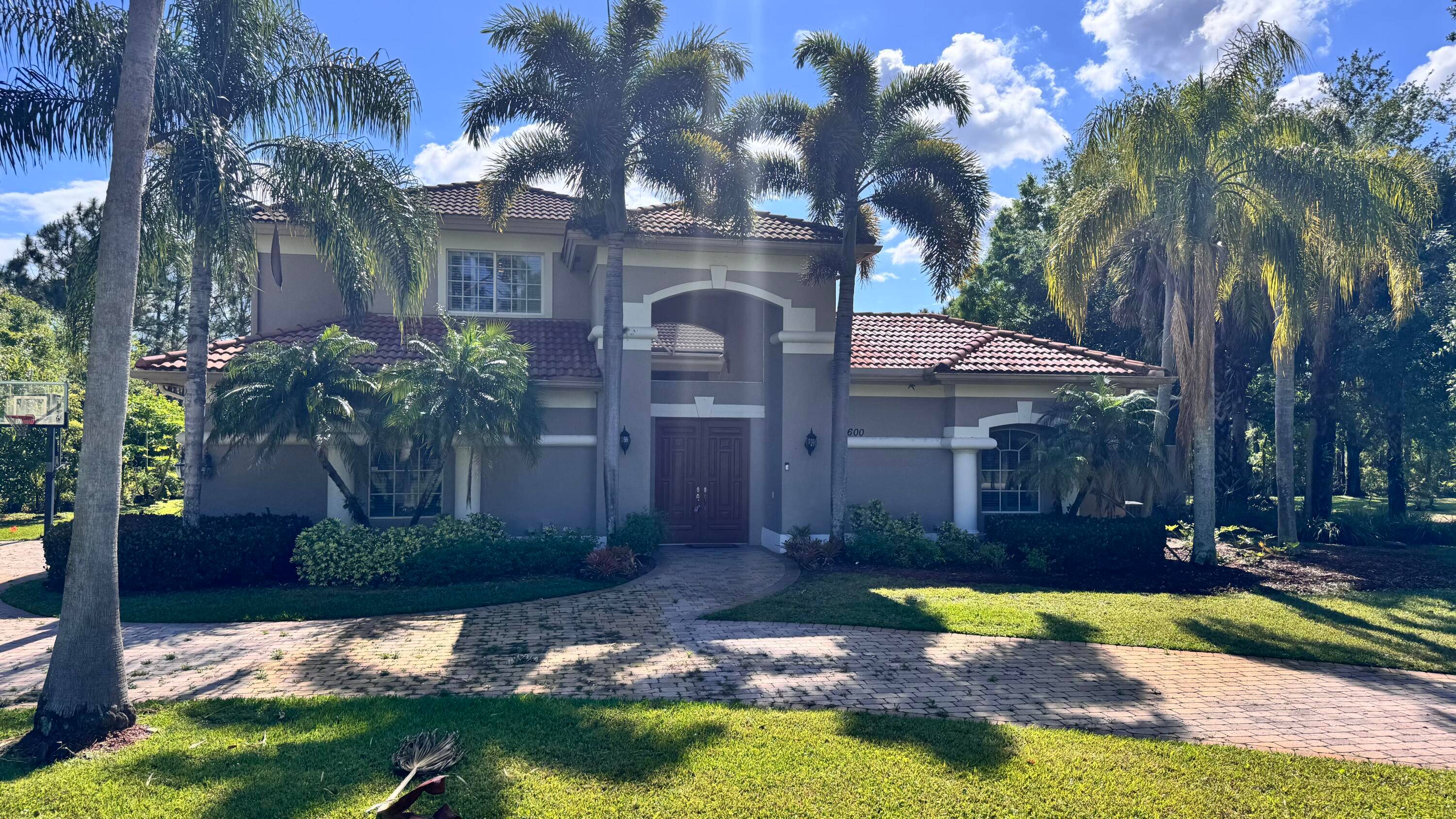 Nestled in the highly desired Enclave at PGA Village, this luxurious 5BR, 5.