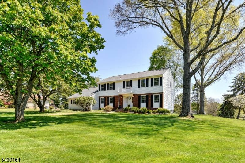 Stately Classical colonial sits upon a sprawling yard, tucked in an idyllic cul de sac neighborhood, exemplifying a move in ready home !