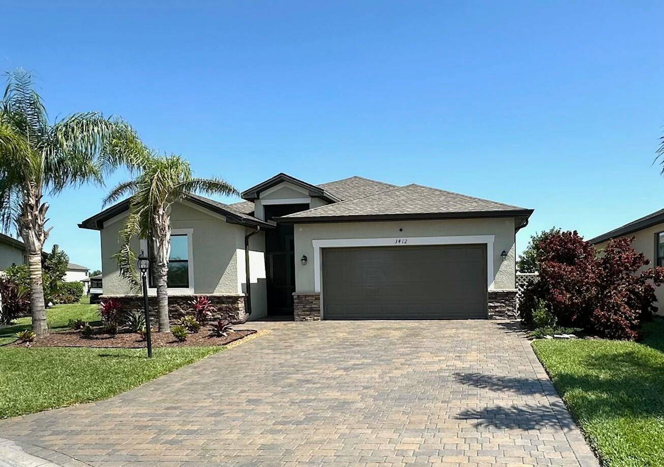 Experience the ultimate in luxury living with breathtaking sunrises and serene moonlit nights in this beautiful lakefront pool home located in the gated Portico community.