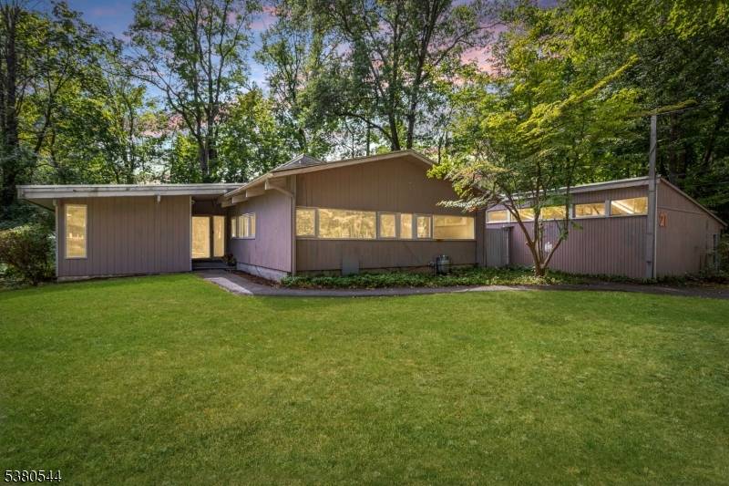 Step into the promise of possibilities with this classic mid century modern home, located in one of Morristown's most sought after neighborhoods.