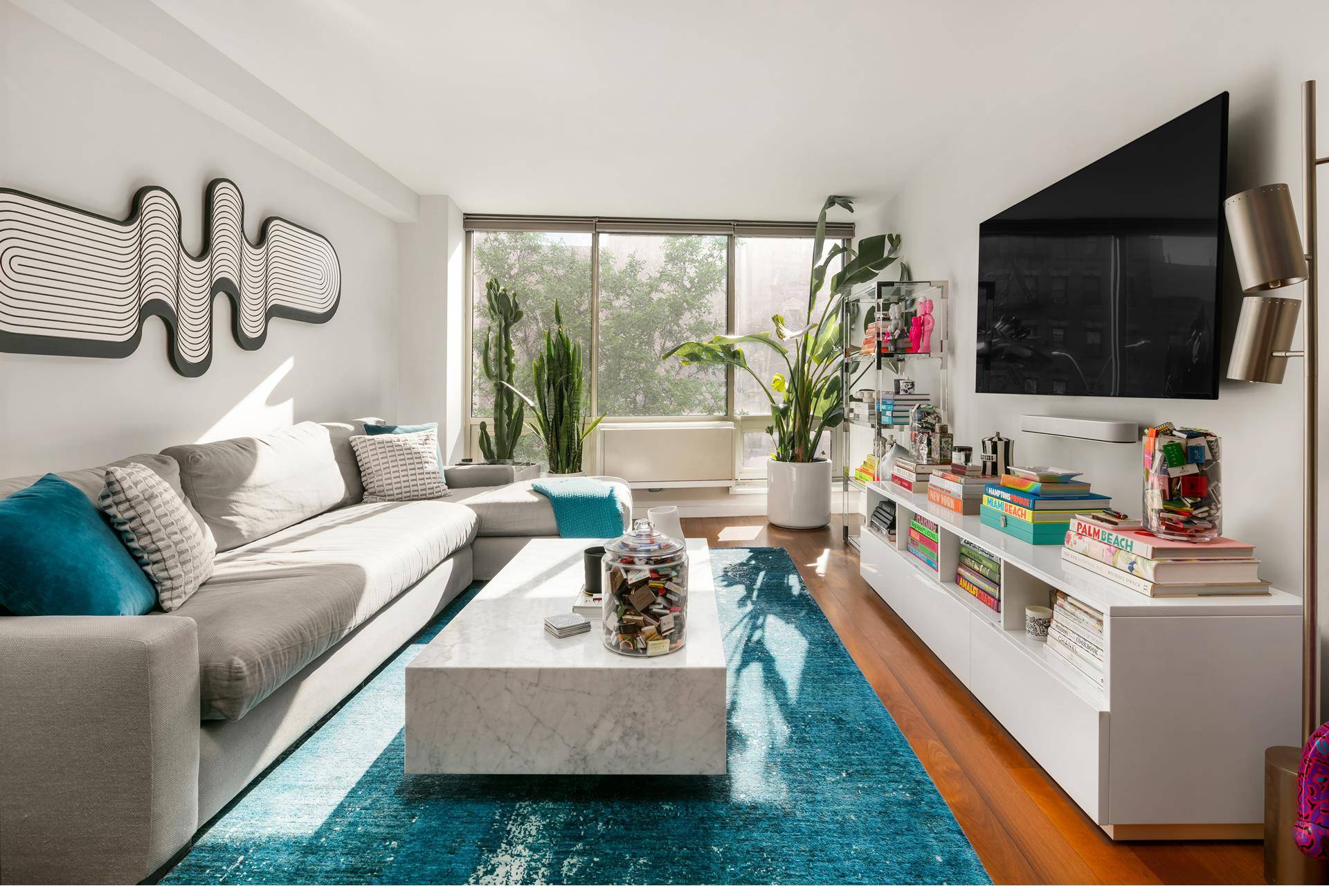 Sun drenched contemporary condo living awaits in this mint condition one bedroom, one bathroom residence featuring upscale finishes, incredible storage, and an unbeatable location where the East Village meets the ...