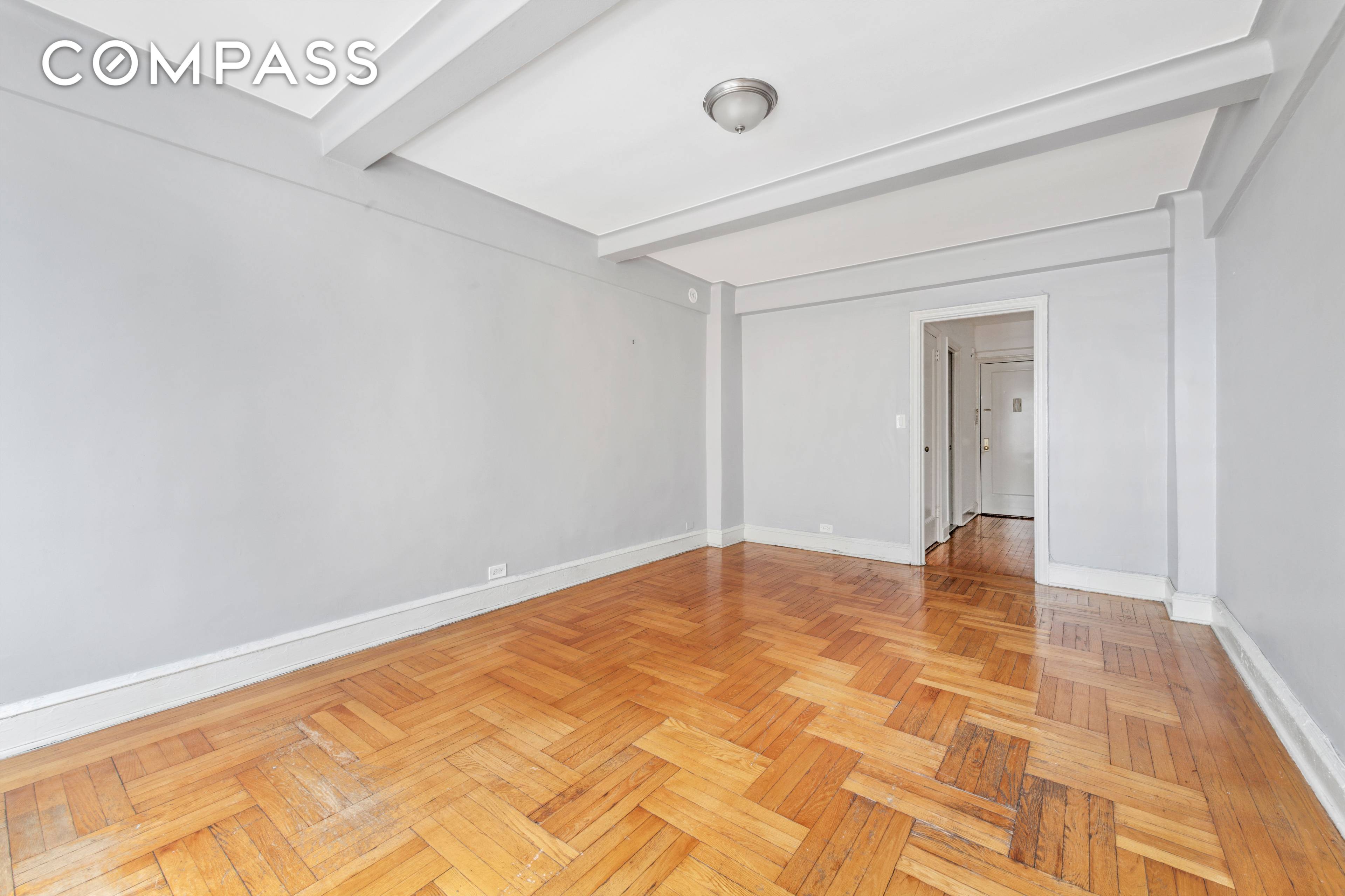 Sunny studio in a full time doorman, elevator building, with low monthlies !