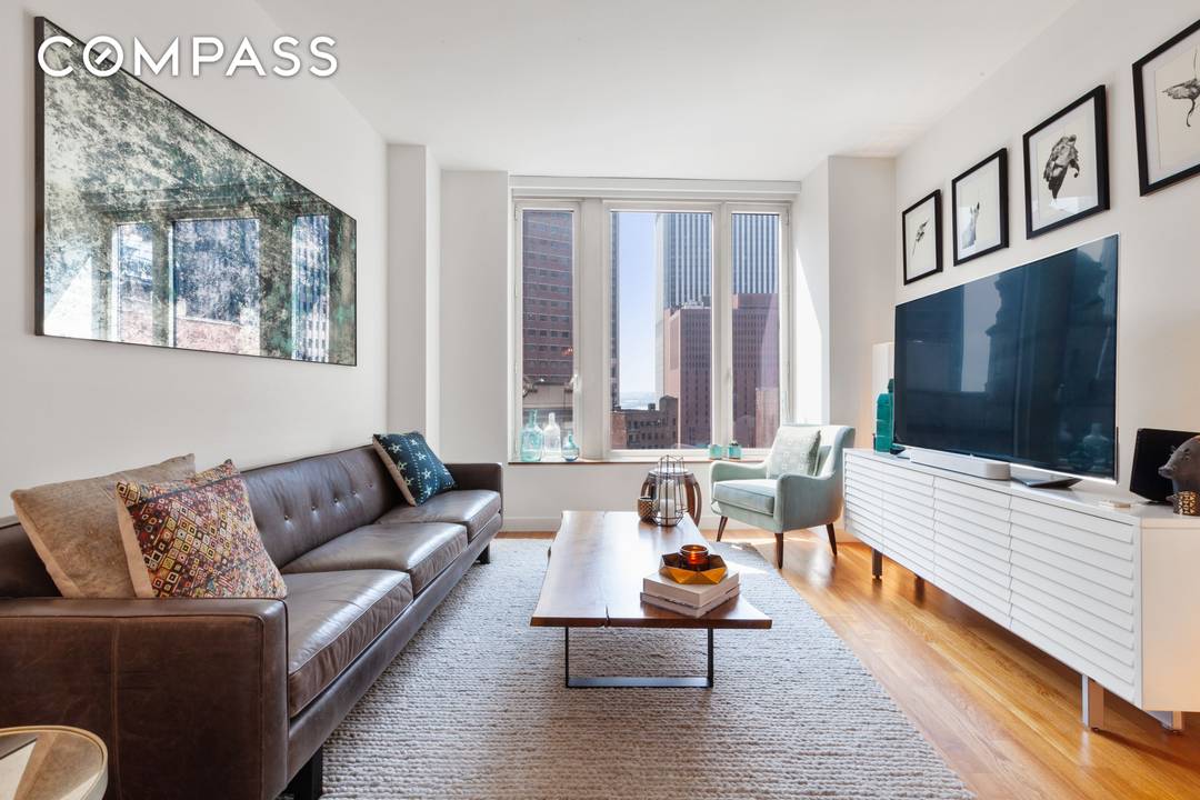 Residence 15C at 15 William Street offers a rare combination of scale, light, views, and thoughtful design in one of FiDi s most amenity rich condominiums.