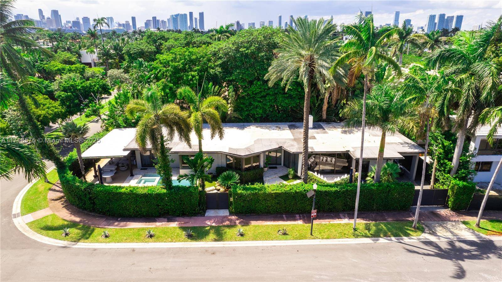 A tropical retreat on the highly sought after Venetian Islands presents a stunning 3 bedroom residence with a den, all on one level.