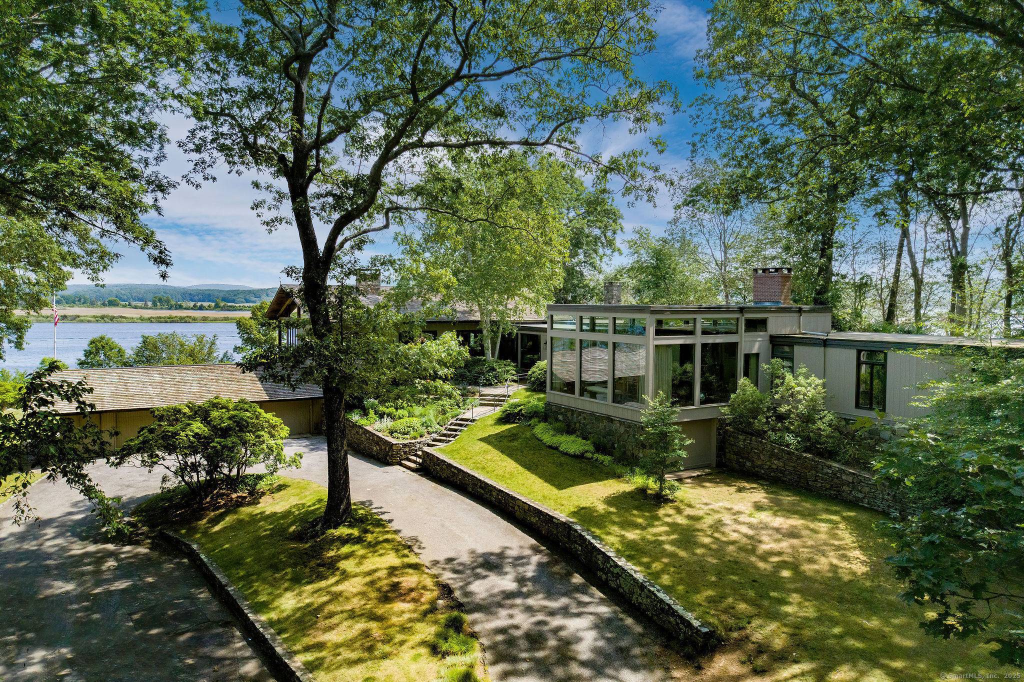 Presenting a single level light filled mid century modern masterpiece, set on a prominent 2.
