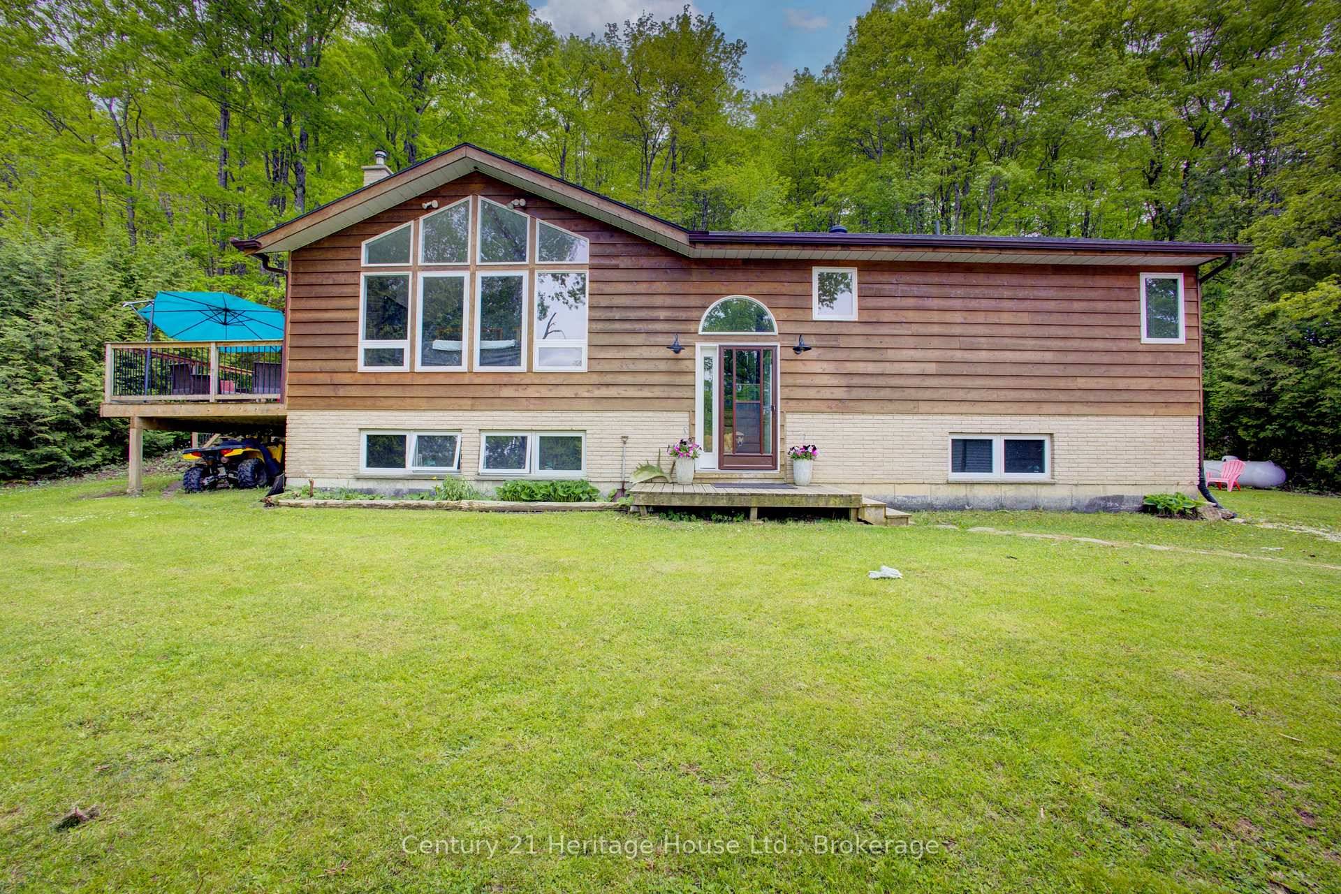 If your looking for Privacy on 7 acres of mixed Trees then this home is for you.