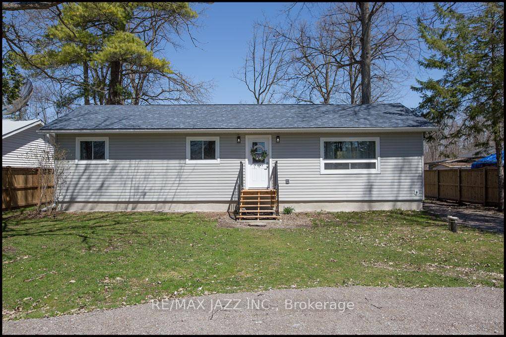 Professionally renovated 4 Season 3 bedroom Bungalow, Featuring gourmet Kitchen with Sile stone countertops, all new appliances, open concept great room with cathedral ceilings, plank flooring, abundance of pot lights ...