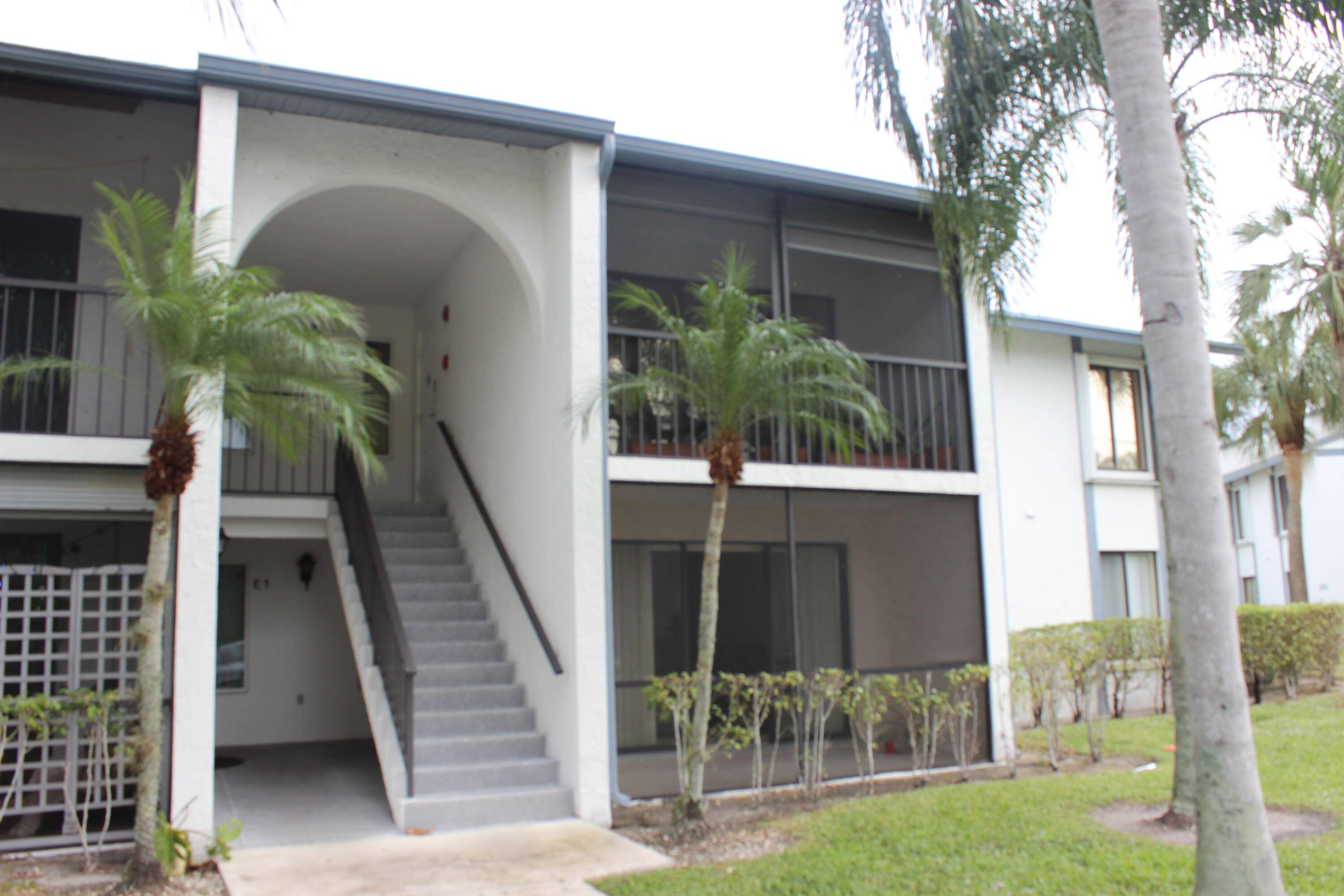 Spacious and well maintained second floor 2 BE 2 BA corner unit in gated community of Palm Club.
