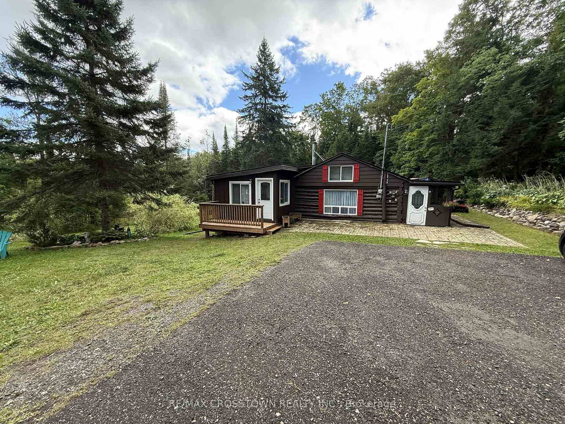 Welcome to this charming 2 1 bedroom log home, perfectly located on 5 private acres just 10 minutes from Prospect Lake and close to Hwy 118 and Hwy 11 !