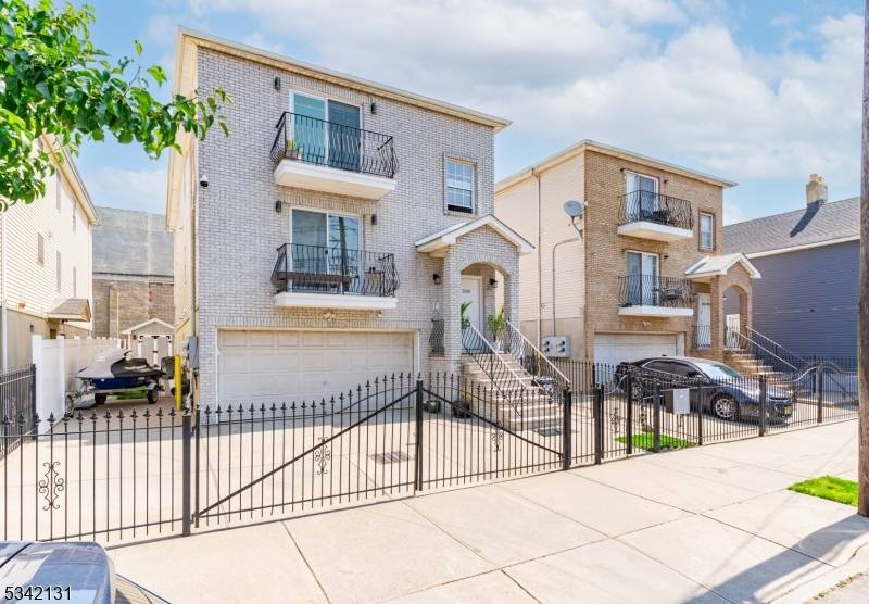 Better than new ! ! ! Gorgeous newer construction Impeccably maintained conveniently located in the sought after South Ironbound section of Newark, this three family property features large spacious rooms, ...