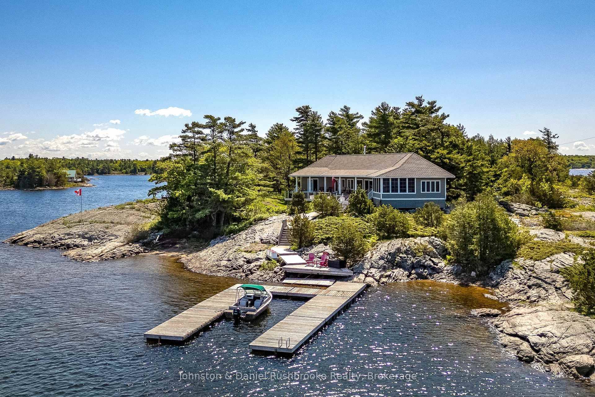 Carved from granite and framed by windswept pines, this stunning island in Georgian Bay's prized Cognashene area offers 520 feet of pristine shoreline and 1.