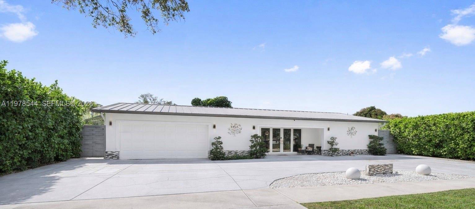 Experience elevated South Florida living in this beautifully renovated 5 bedroom, 4 bath single family residence with no HOA.