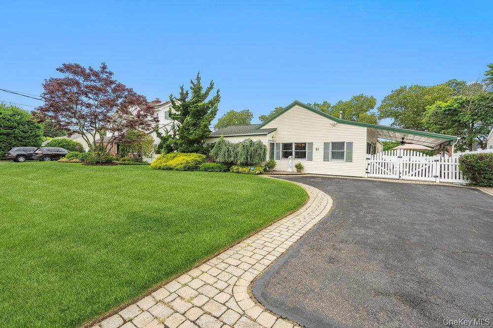 Discover the allure of this captivating Amityville residence, a perfect blend of character and modern updates nestled in a community you'll love.