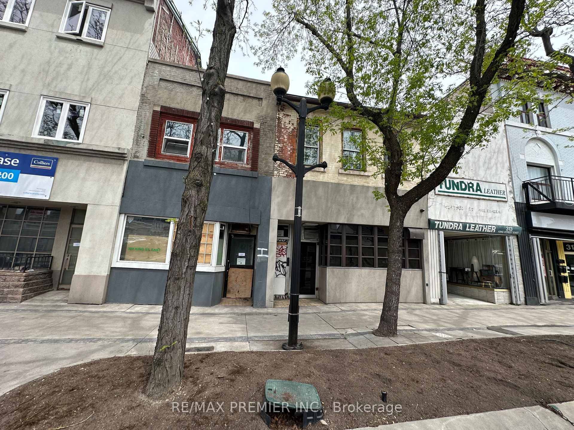 Two adjacent freestanding buildings at 309 amp ; 311 King St E are for sale separately or as one.
