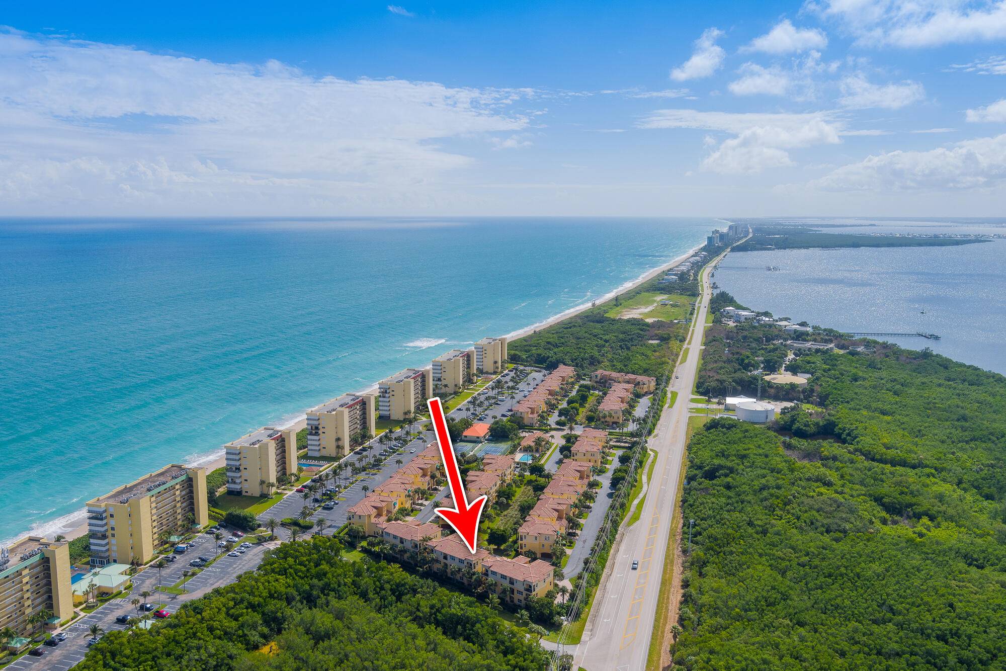 PRICE REDUCED Experience the ultimate coastal lifestyle in this stunning three story townhouse, nestled in the highly sought after gated community of Ocean Bay.