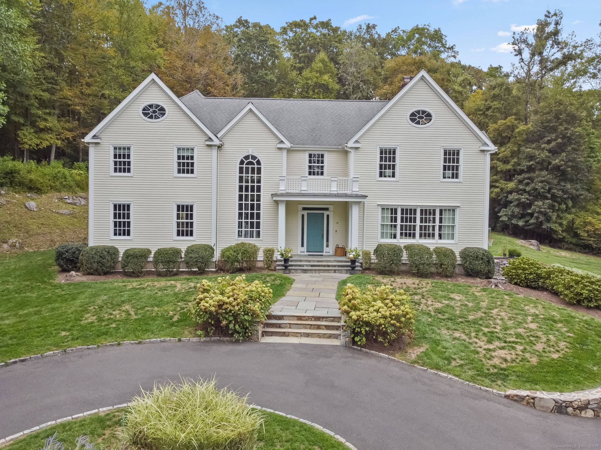 Exceptional 6 bedroom colonial with custom 12 person spa in a private, tranquil setting.