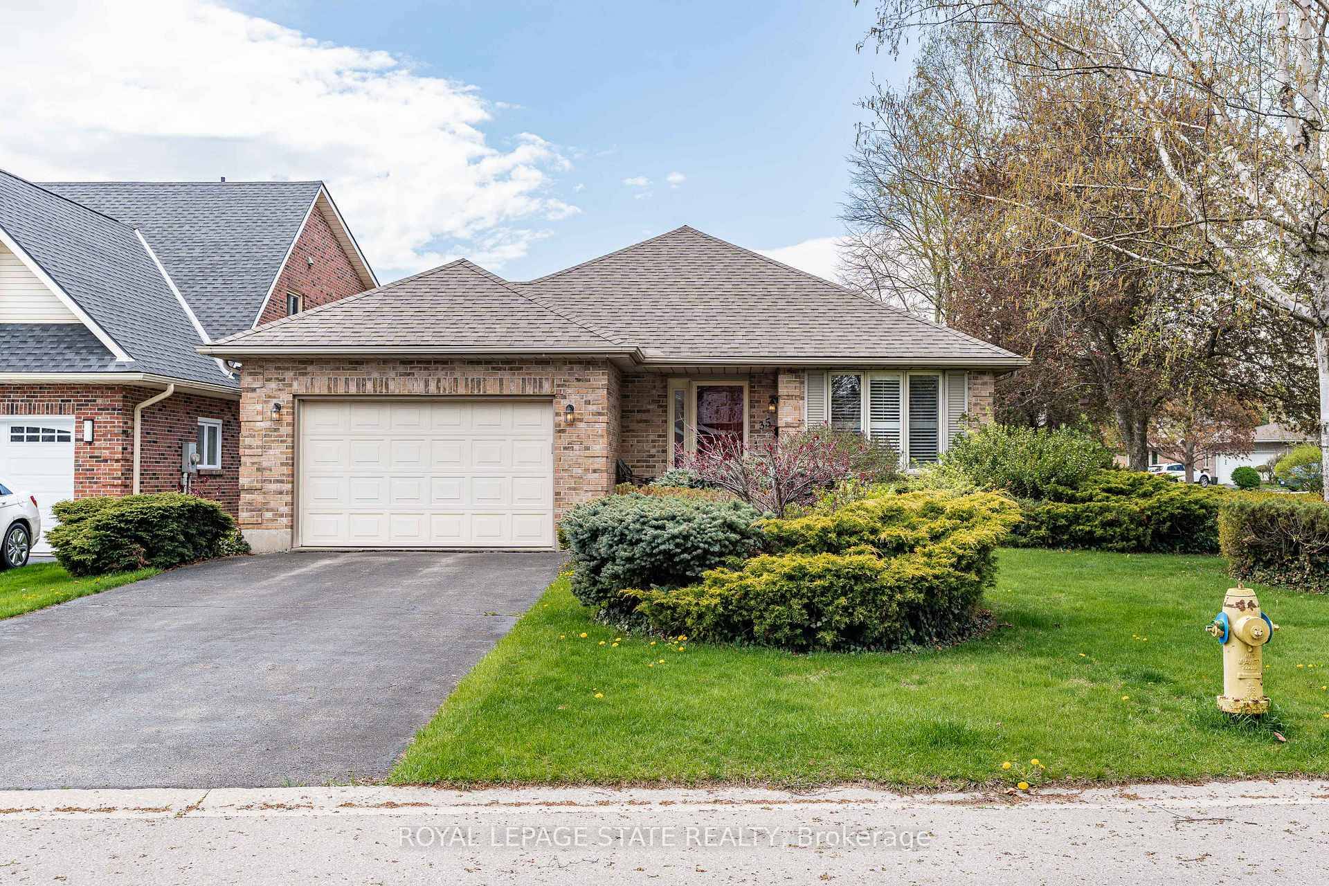 Nestled in the charming community of Simcoe, this beautifully maintained 2 1 bedroom, 2 bathroom bungalow blends comfort, charm, and functionality on a mature 56.