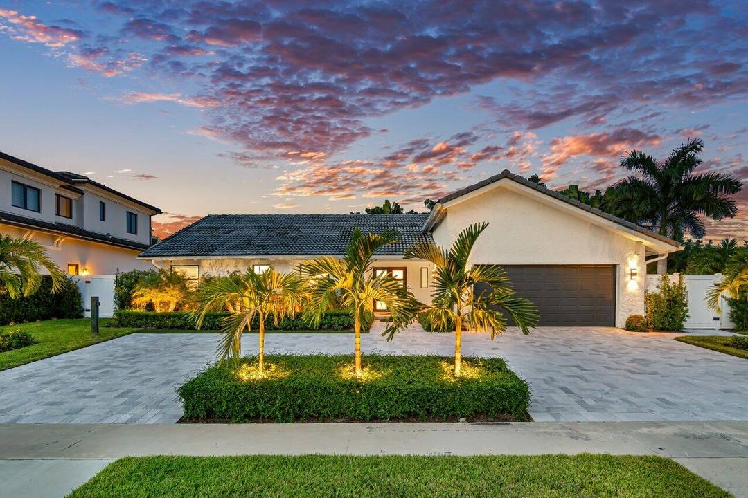 One story captivating custom contemporary in Thornhill Green, a highly esteemed Central Boca Raton community.