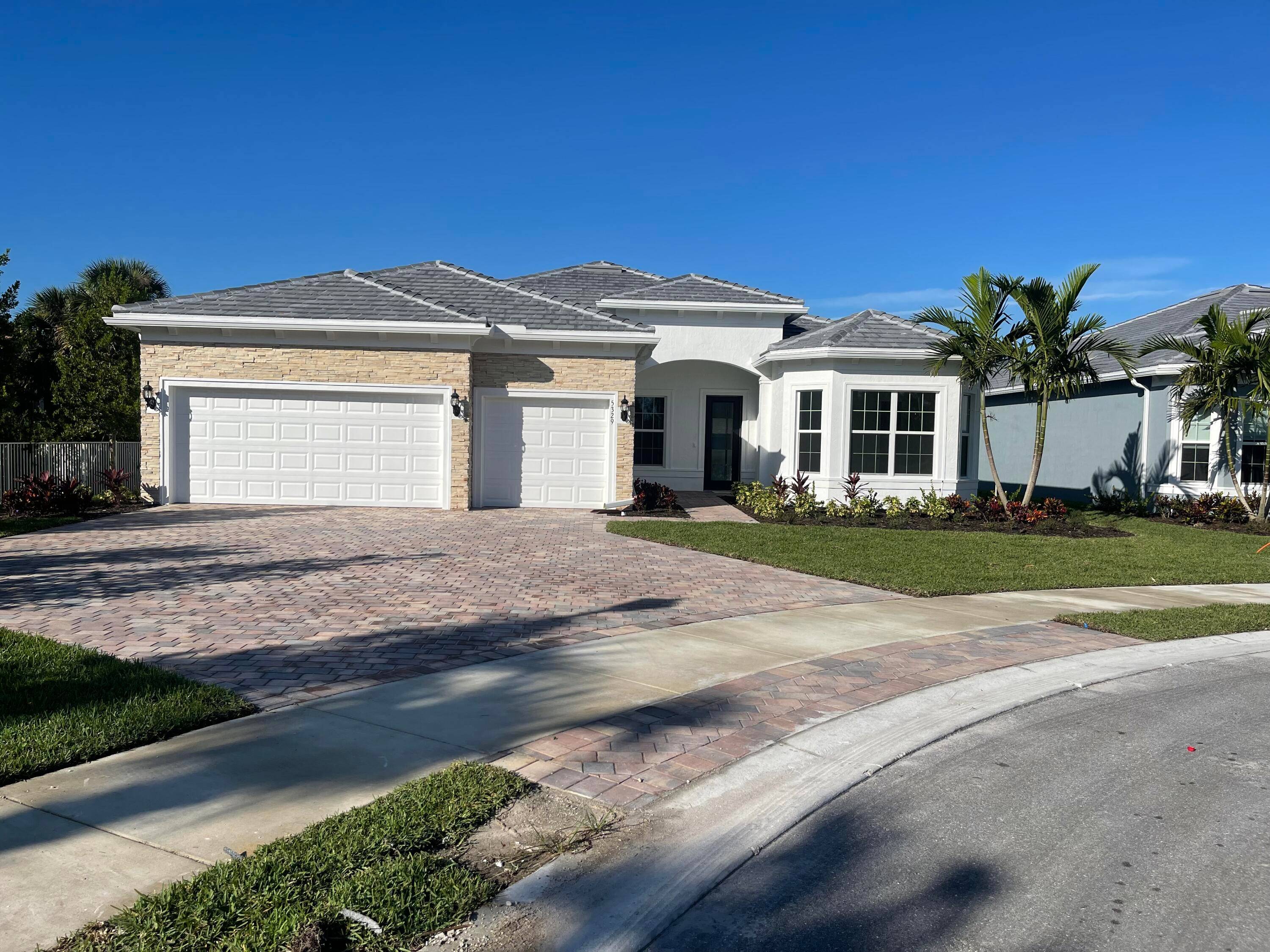 Experience luxury living in Windsong Estates, gated community in Lake Worth, designed with a focus on contemporary comfort and convenience.