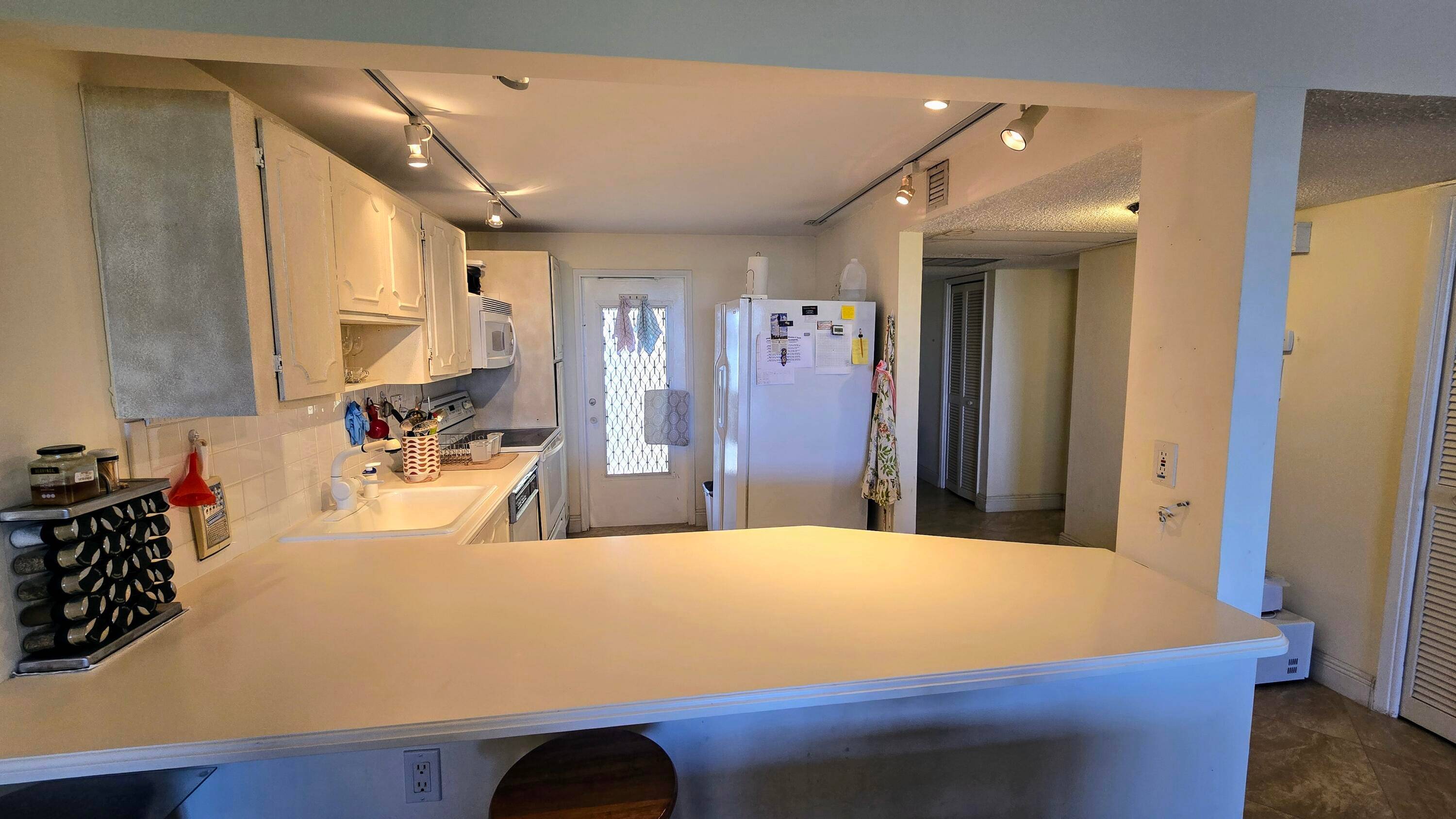 Enjoy serene lake views from this bright and spacious 3 bedroom, 2 bath corner unit in Palm Aire.