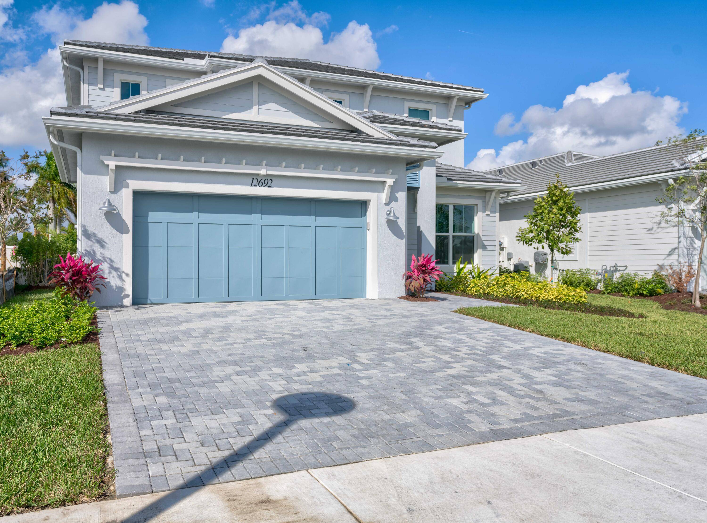 The Torrance's stunning two story covered entry and foyer reveal a beautiful formal dining room and spacious office, with views to the expansive great room and the expansive covered lanai.