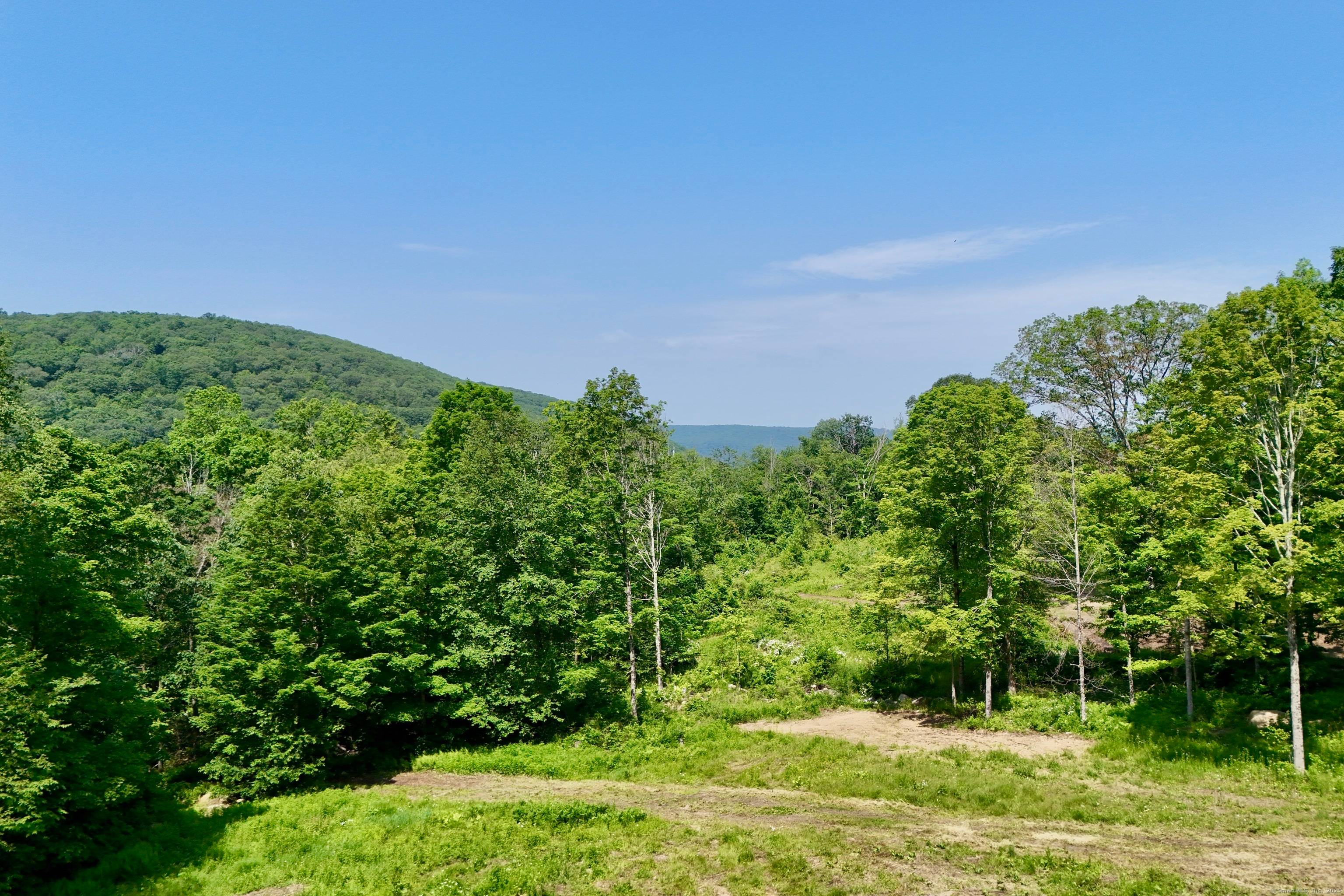 Incredible opportunity in Kent featuring breathtaking westerly views and over 50 acres of land.