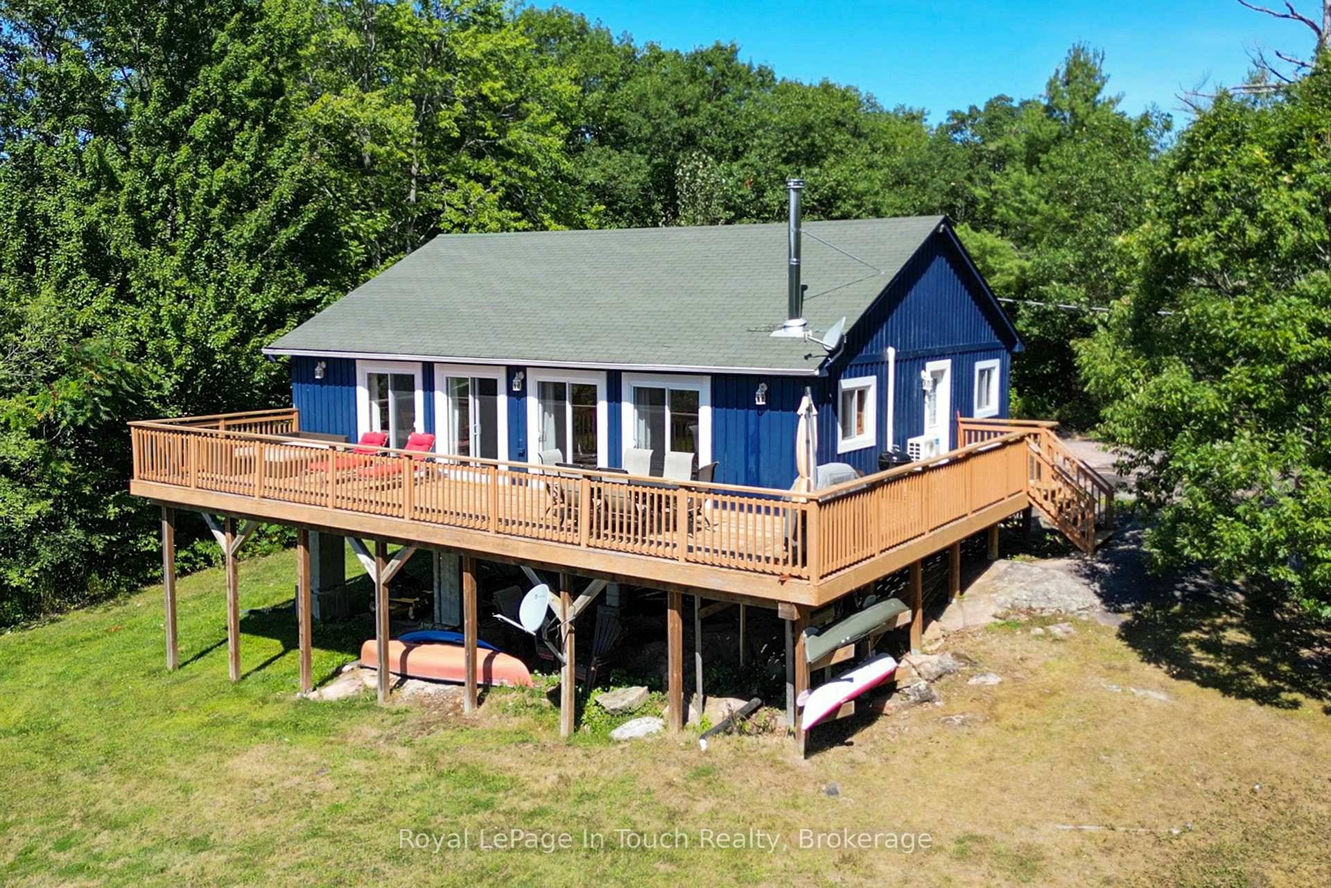 BY BOAT ONLY Just a few short minutes in the boat and you'll arrive at this well maintained cottage.