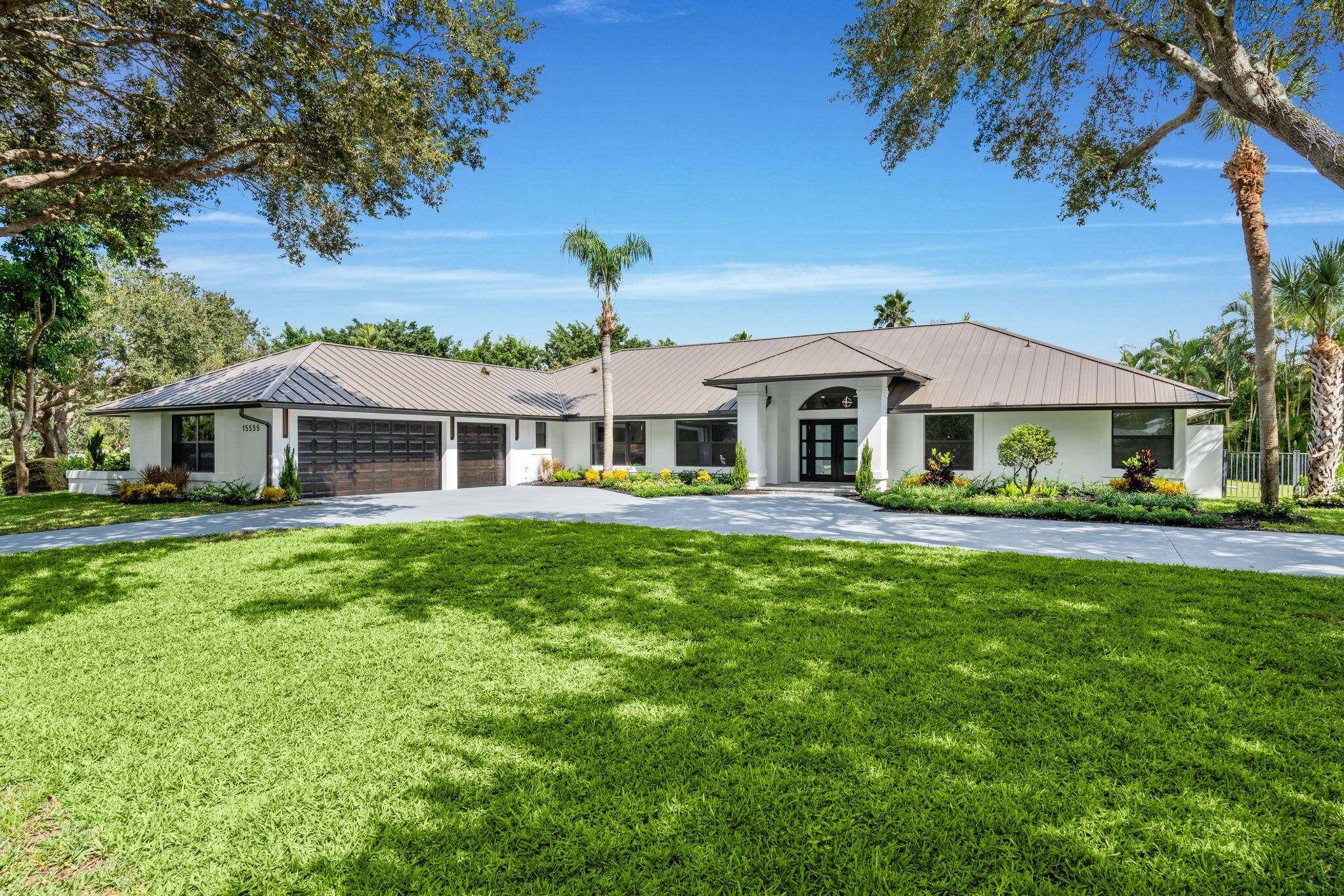 In the heart of Wellington's prestigious Aero Club, this completely renovated single story estate sits on a private 1.