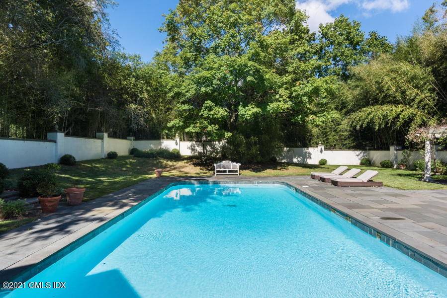 Summer Rental ! Elegant English Manor sits on 2 beautifully landscaped acres in prestigious Rock Ridge Association near town schools.