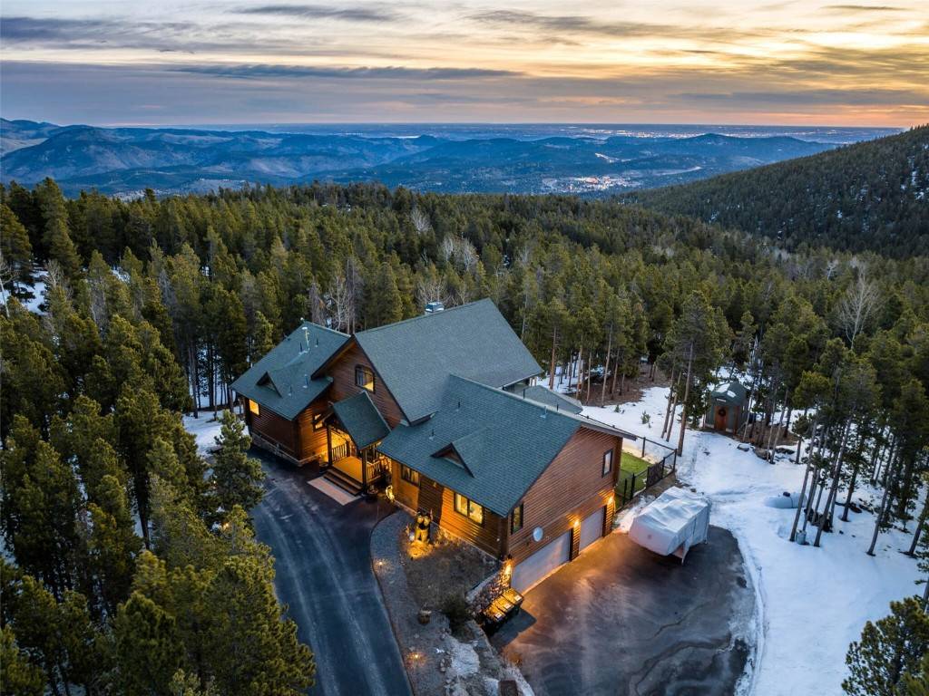 JUST 15 MINUTES FROM SKIING with access to miles of trails, this beautiful mountain cabin beckons the avid outdoor enthusiast looking for a prime mountain getaway.