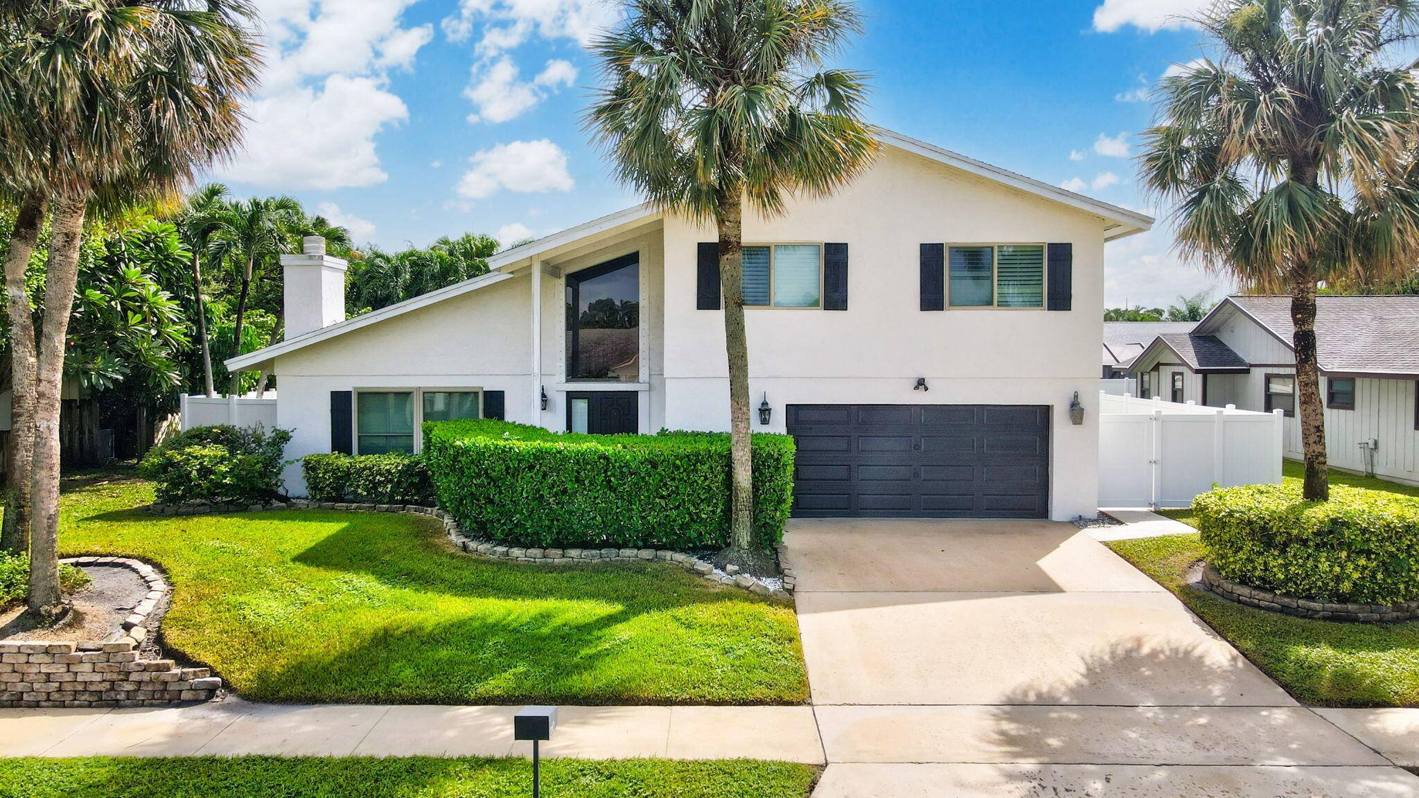 Discover this exceptional home in the highly sought after East Boca's Pinelands North with no HOA.