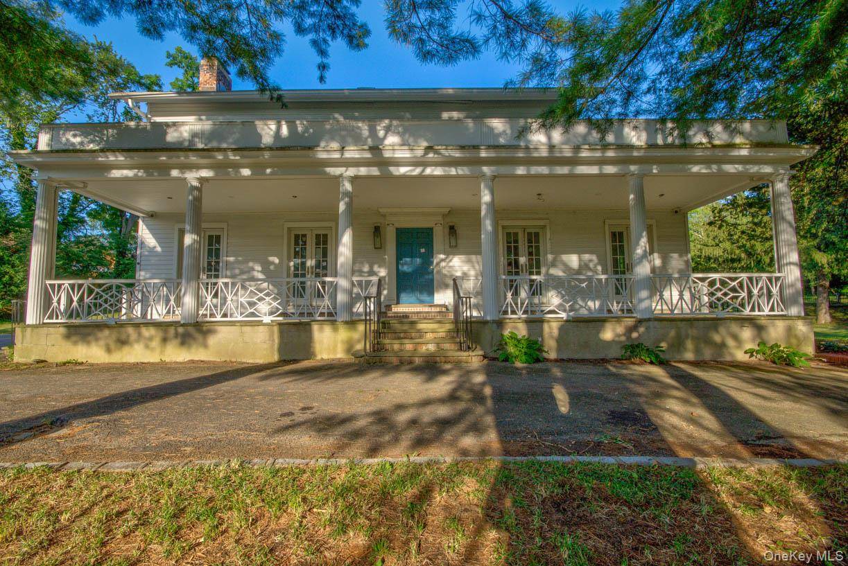 Detached Center Hall colonial set on an oversized 1.
