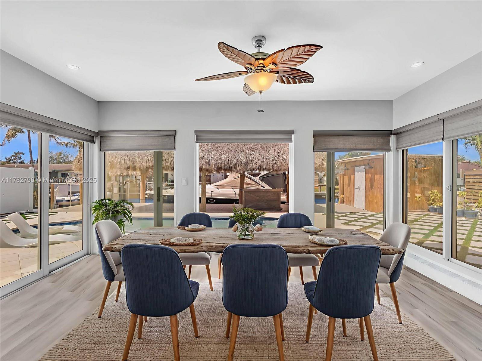 JUST REDUCED ! Step onto your boat from your private dock and head out to the ocean or unwind in the comfort of your Tiki Hut.