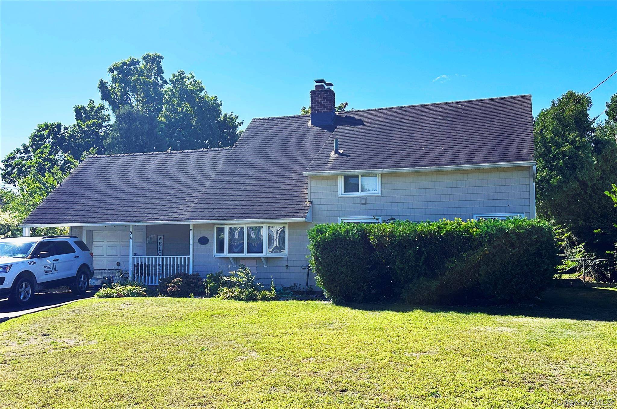 Rare one family cape in Levittown with a large 8349sf lot !