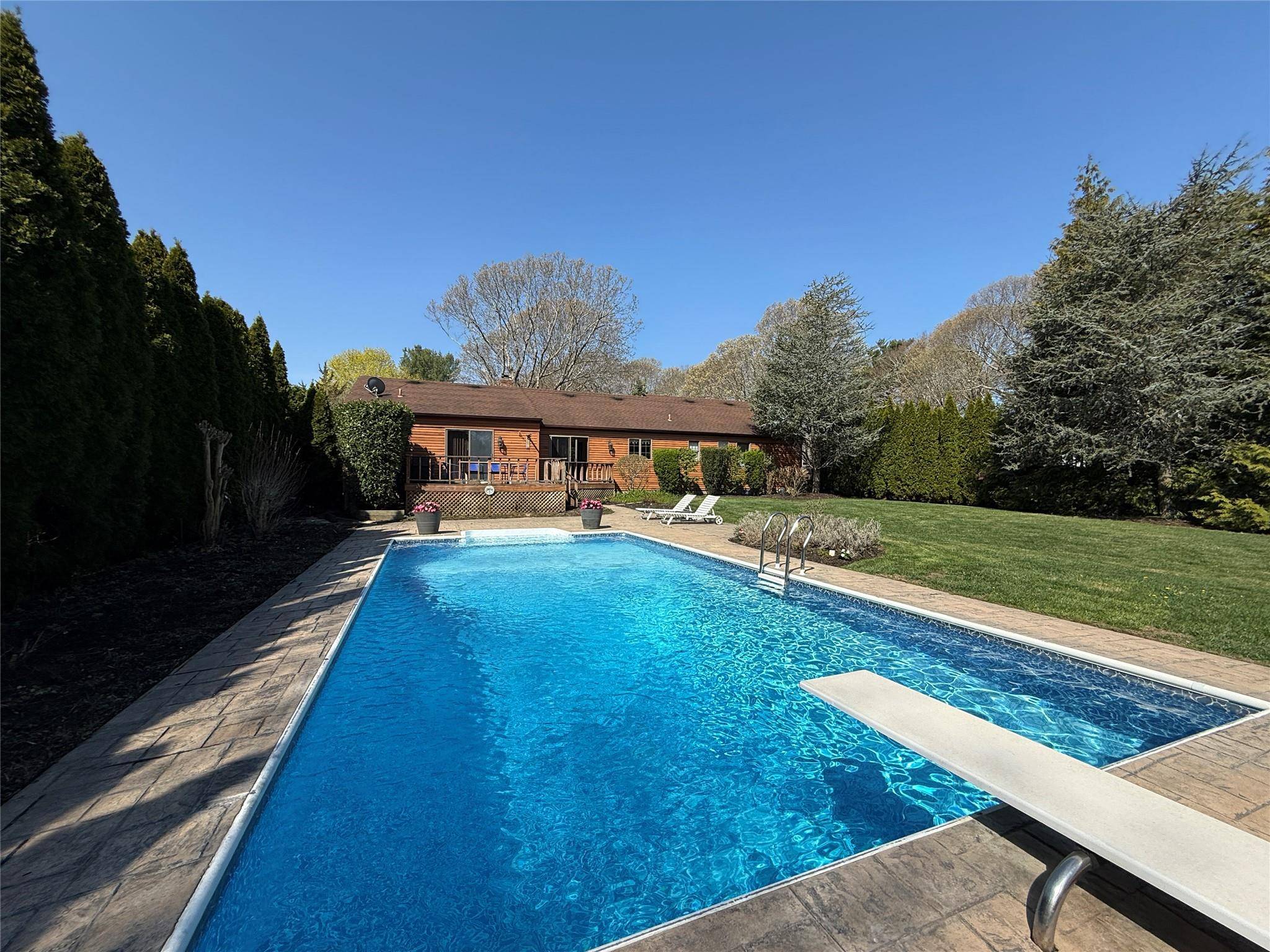 Welcome to this beautifully maintained 3 bedroom, 2 bath ranch set on a pristine half acre.