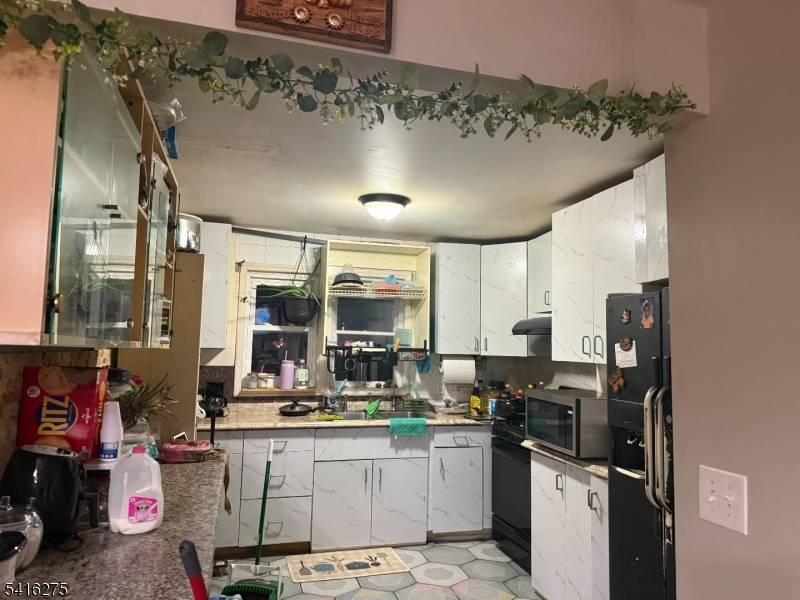 Welcome to a great single family home with x large backyard, livingroom dining rm kitchen, hardwood floors, finished full walkout basement with central Air.