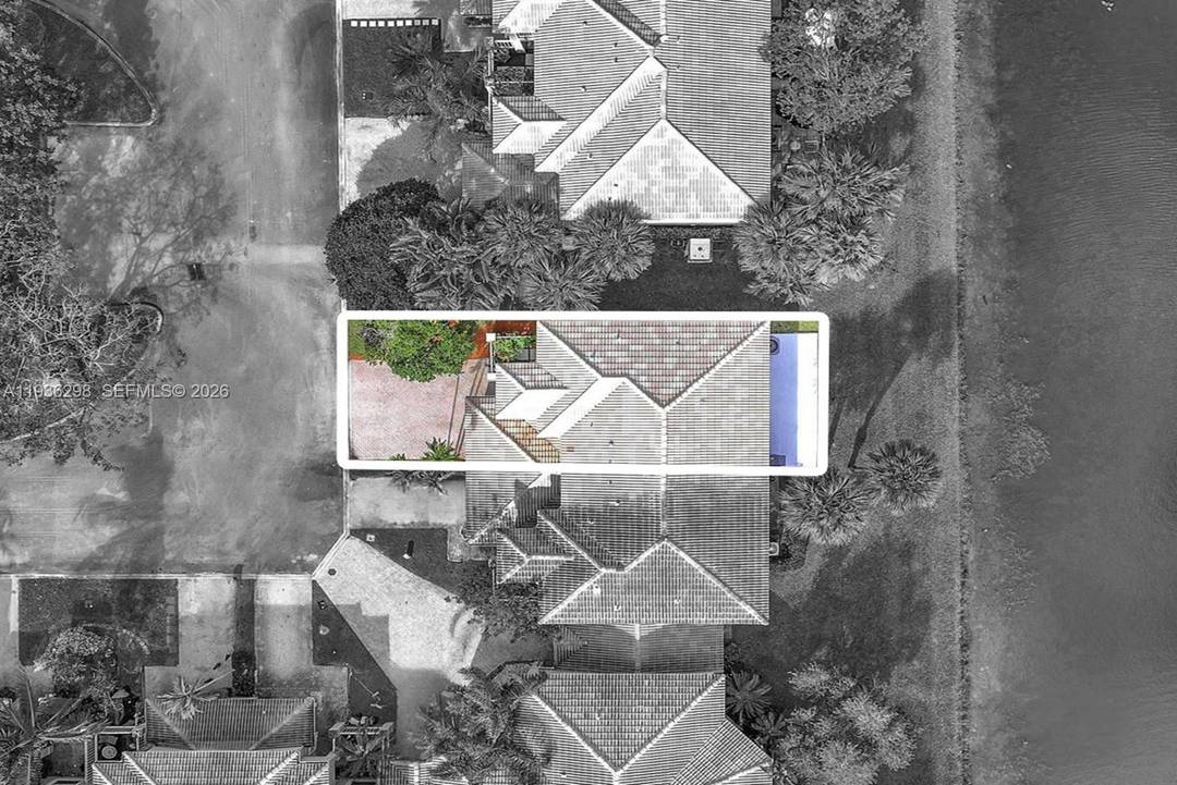 Spectacular fully re imagined lakefront corner townhome located in the prestigious gated community of Pembroke Isles.