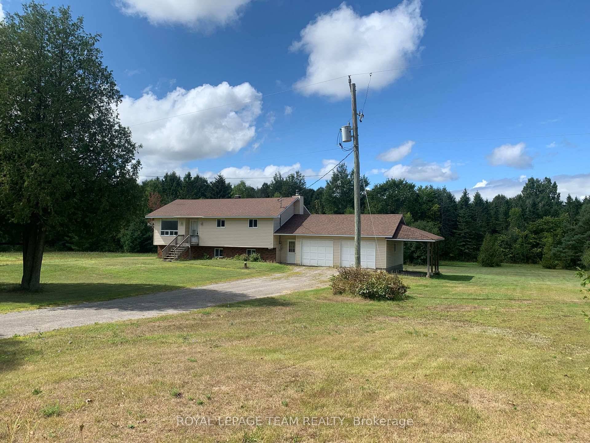 Check out this raised bungalow with walkout basement huge double car garage just 10 minutes from the town of Merrickville.
