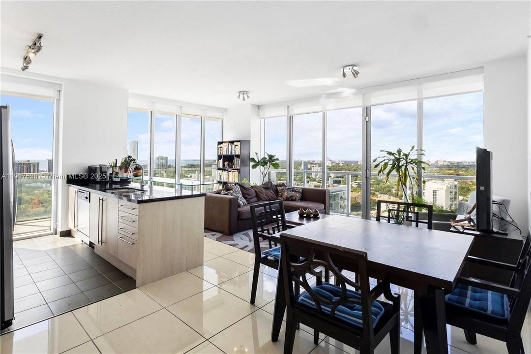 Stunning corner unit, featuring a desirable split floor plan, floor to ceiling impact glass, and unobstructed views of the Miami skyline and sparkling waters.