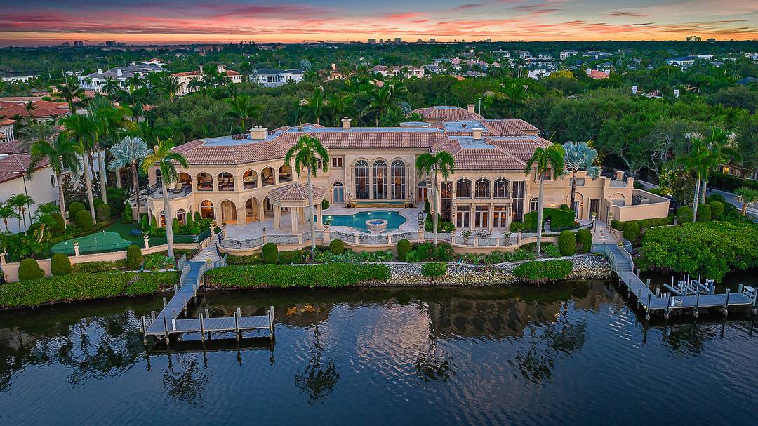 Introducing a palatial waterfront estate on a double lot in the exclusive community of Admirals Cove, where timeless design meets South Florida luxury.