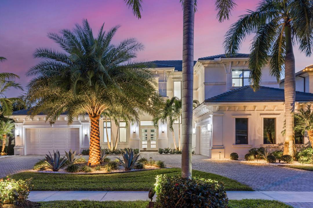Experience luxury living in this breathtaking Vanderbilt model with 7, 879 SF SF on a stunning lakefront lot with a lanai, pool and sports court.
