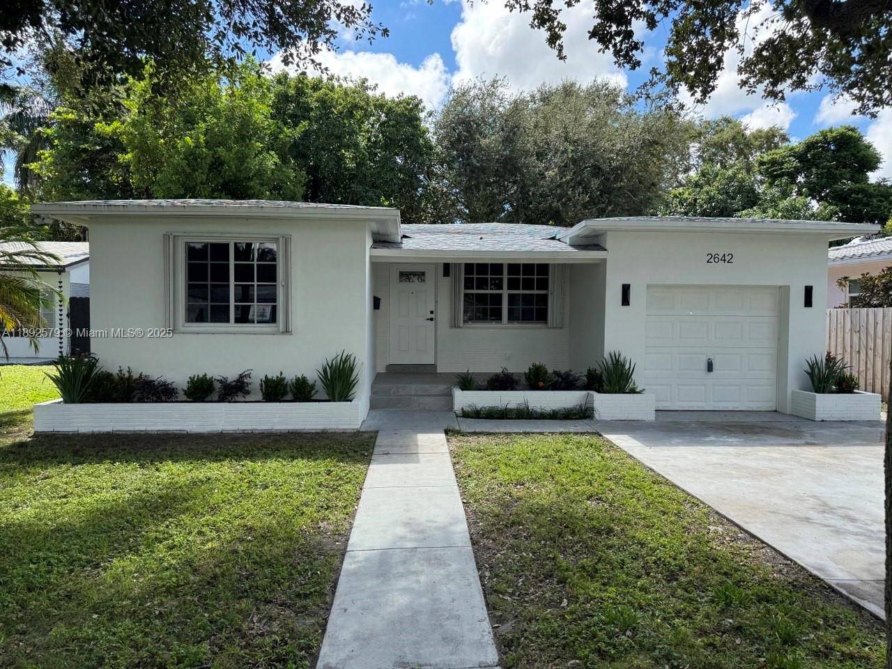 This charming 2 bedroom, 1 bathroom single family home is nestled on a beautiful, peaceful street just moments from Hollywood Beach.