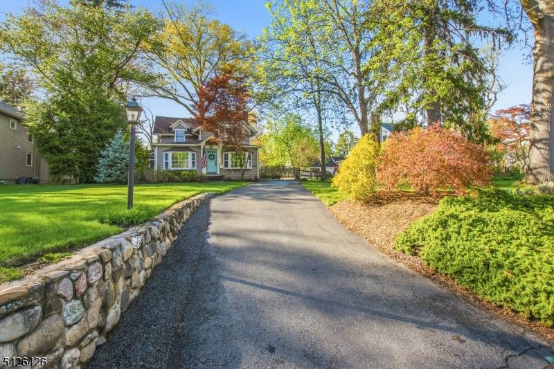 Set back on a 190' deep lot, sits this idyllic expanded cape colonial featuring both old world charm and modern day updates.