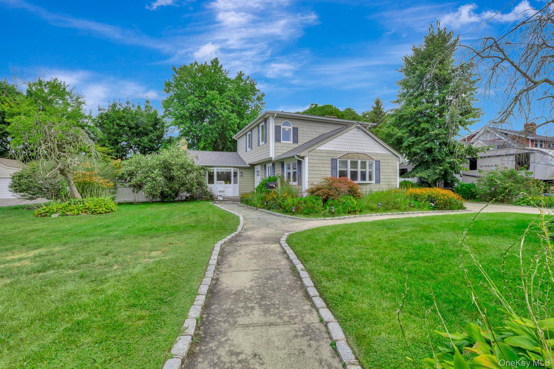 Welcome to this beautifully appointed 4 bedroom home in highly desirable South Sayville.