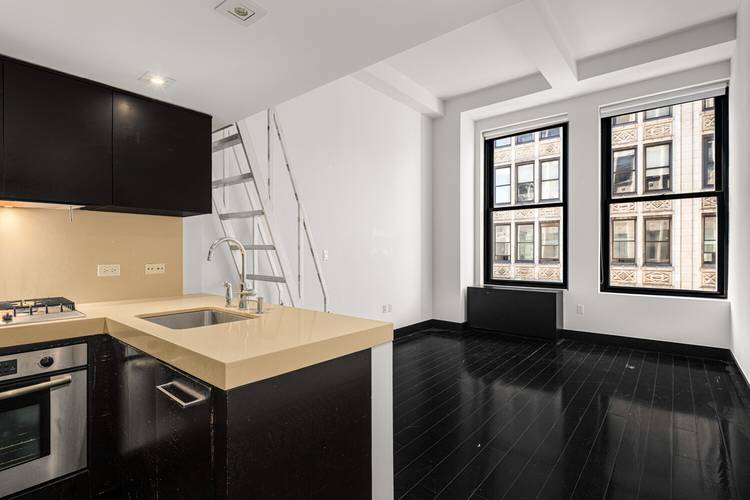 Welcome to your Flatiron sanctuary, a thoughtfully designed studio loft that maximizes every square foot with soaring 11 foot ceilings and oversized corner windows that flood the space with natural ...
